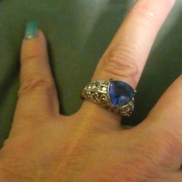 Sterling silver with cz and tanzanite center stone. - Picture 4 of 4